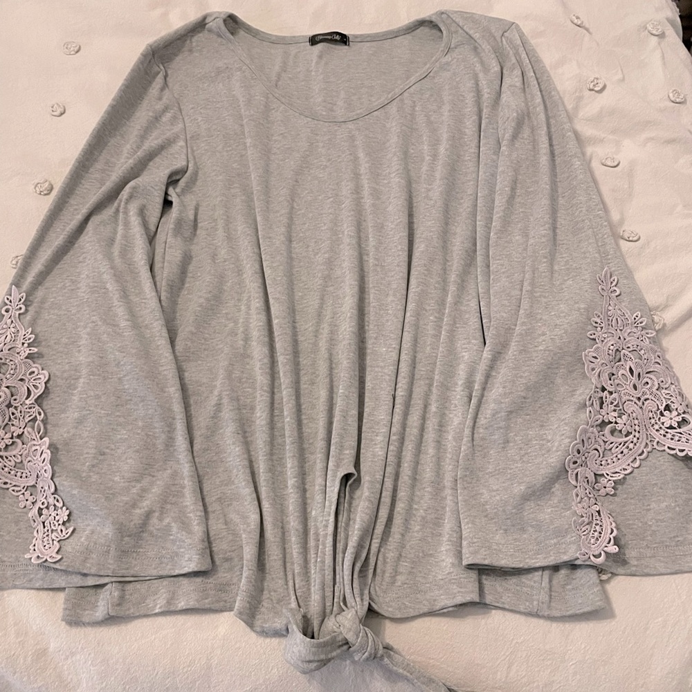 Grey top with lace detail on the sleeve!
